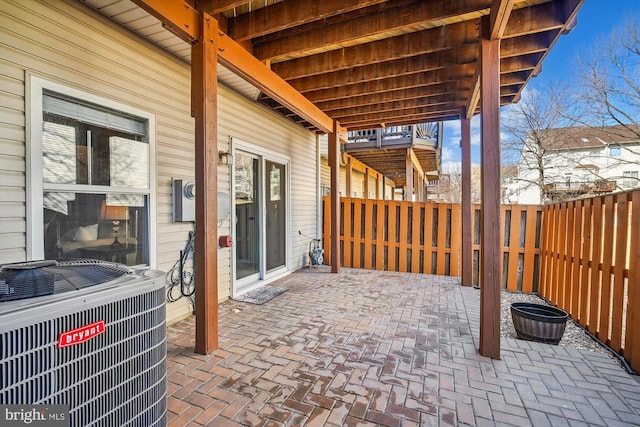 view of patio / terrace featuring central AC unit and a fenced backyard