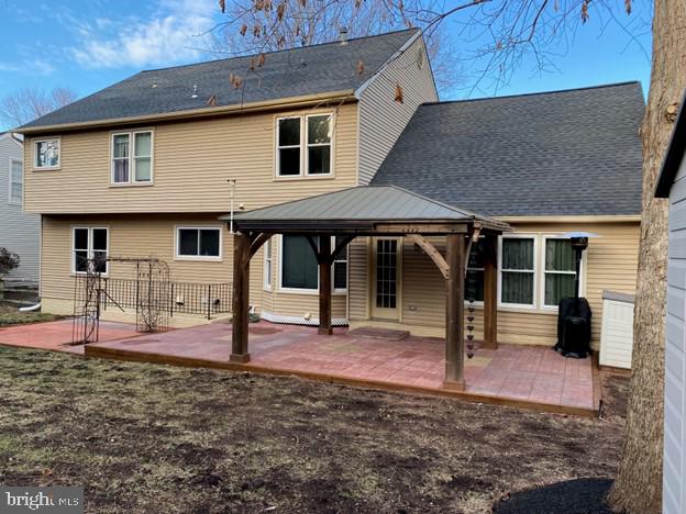 rear view of house featuring a patio