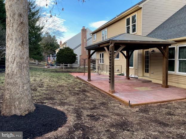 view of yard with a patio area, fence, and a gazebo