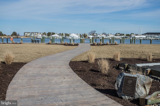 dock area with a water view and boat lift