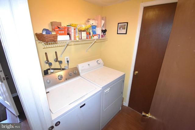 laundry area featuring laundry area, separate washer and dryer, and dark wood finished floors