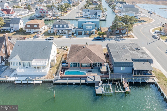 aerial view featuring a water view and a residential view