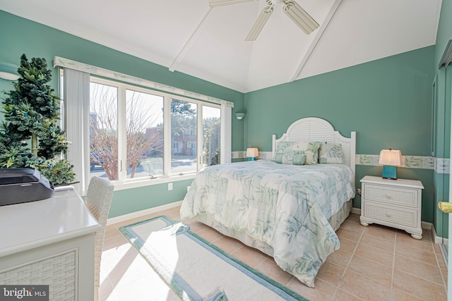 bedroom featuring lofted ceiling, light tile patterned flooring, ceiling fan, and baseboards