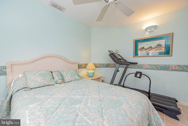 tiled bedroom featuring visible vents and ceiling fan