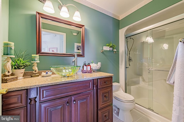 bathroom featuring vanity, tile patterned flooring, a shower stall, and toilet