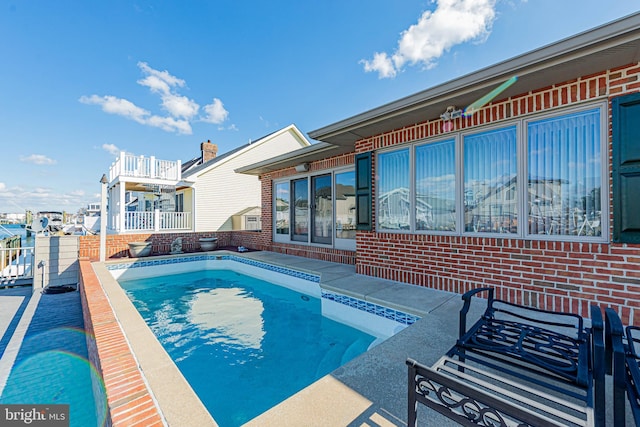 view of swimming pool with a patio area and a fenced in pool