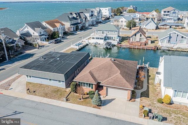 aerial view featuring a water view and a residential view