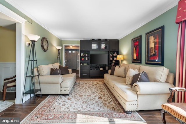 living area with crown molding and wood finished floors