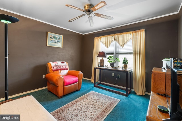 living area featuring carpet floors, baseboards, ornamental molding, and a ceiling fan