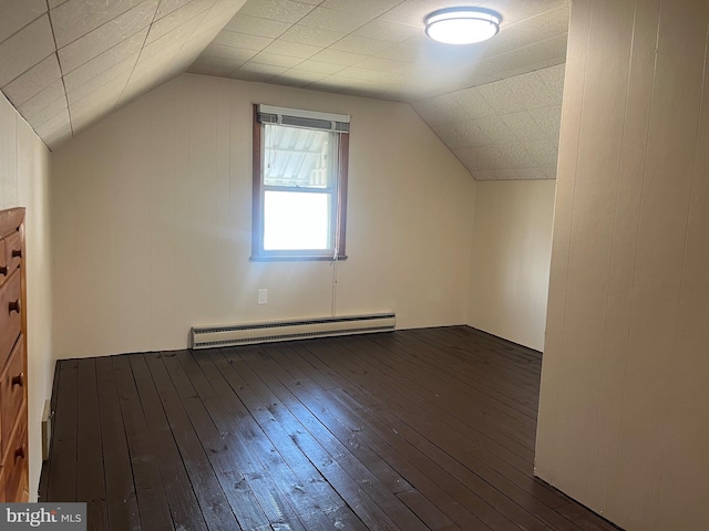 bonus room with vaulted ceiling, dark wood-type flooring, and baseboard heating