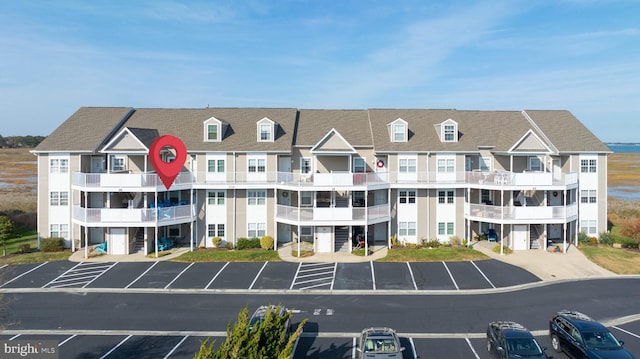 view of property featuring uncovered parking