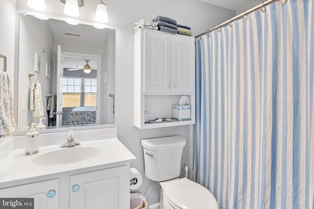 ensuite bathroom with visible vents, vanity, toilet, and ensuite bathroom