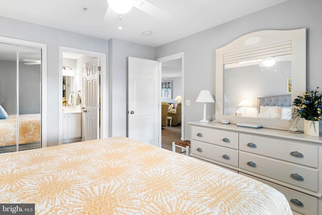 carpeted bedroom with a ceiling fan, a closet, and connected bathroom