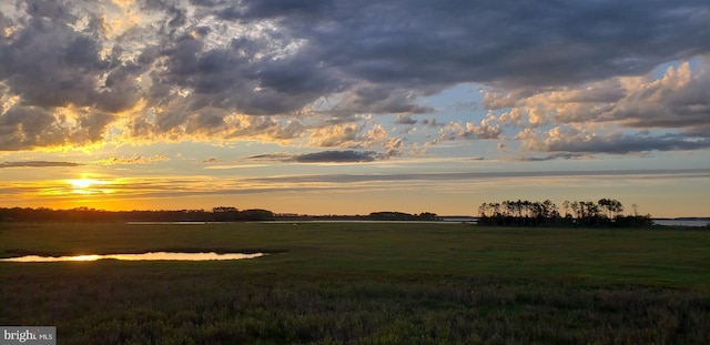 nature at dusk featuring a water view