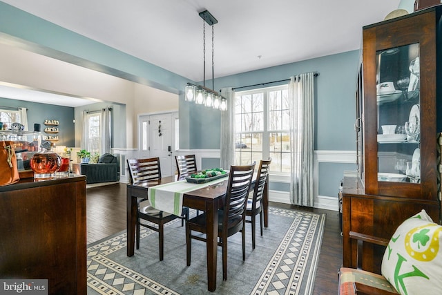 dining space featuring wood finished floors