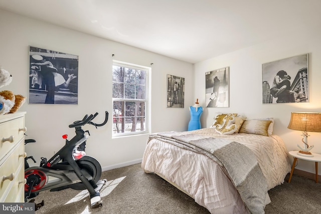 carpeted bedroom with baseboards