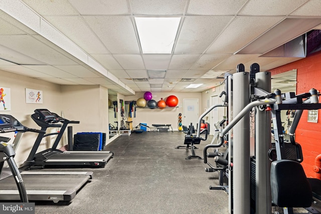 exercise room featuring a paneled ceiling