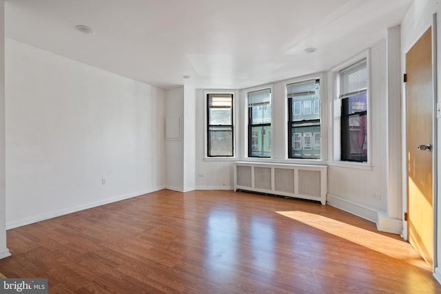 709 E Passyunk Ave, Philadelphia, PA 19147 - empty room with radiator, baseboards, and wood finished floors