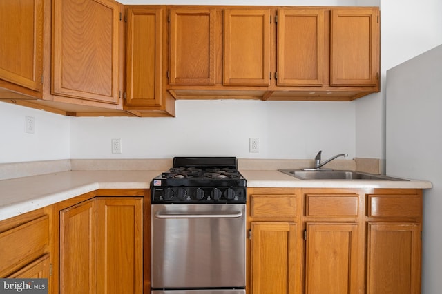 709 E Passyunk Ave, Philadelphia, PA 19147 - kitchen featuring gas range, light countertops, and a sink