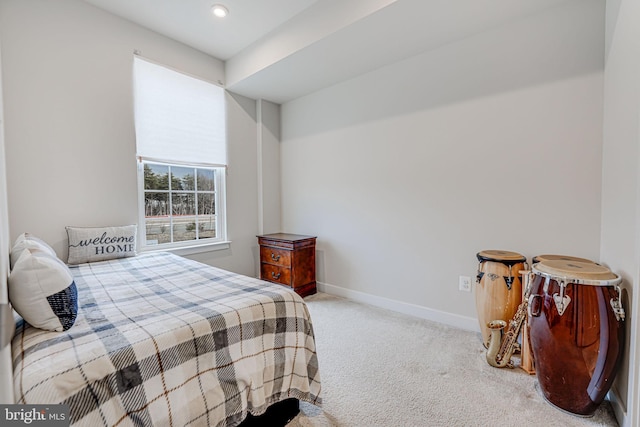 carpeted bedroom featuring baseboards