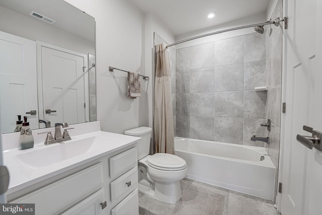 full bath featuring visible vents, vanity, shower / bath combo with shower curtain, and toilet