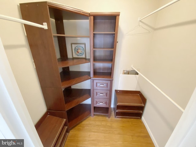 walk in closet featuring light wood-style floors