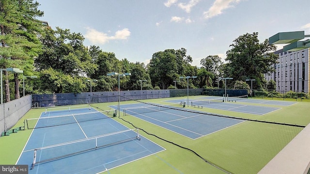 view of tennis court with fence