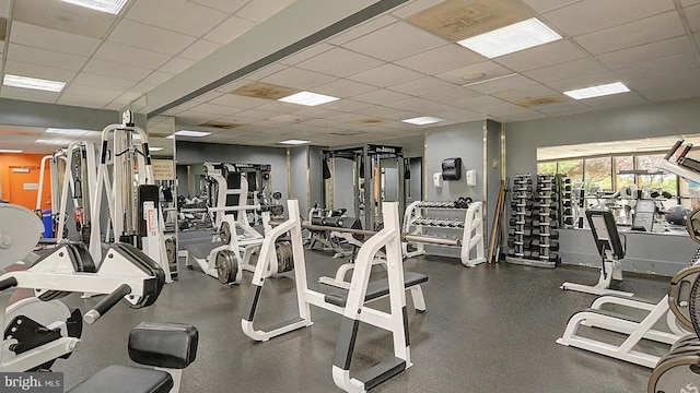 exercise room featuring a paneled ceiling