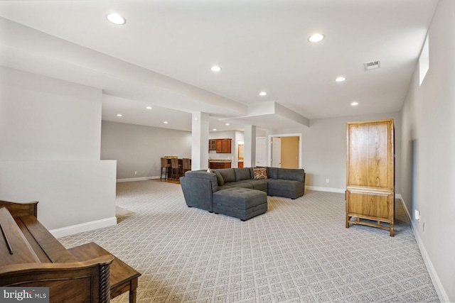 living area with recessed lighting, baseboards, and light colored carpet