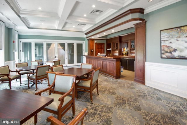 dining space featuring coffered ceiling, beam ceiling, visible vents, and ornamental molding