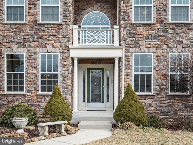 view of exterior entry with stone siding