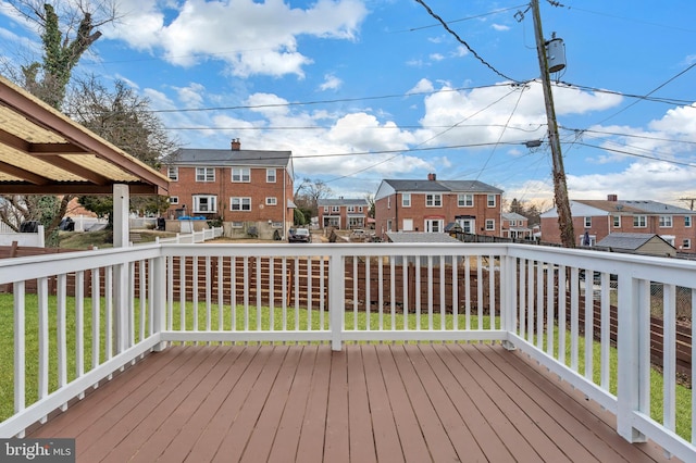 wooden terrace with a residential view