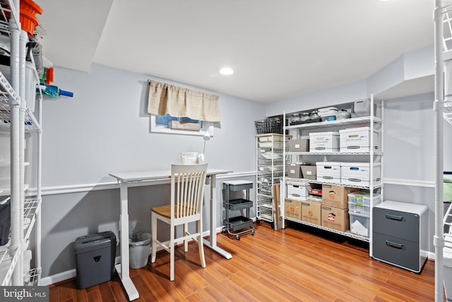 office area with baseboards, wood finished floors, and recessed lighting