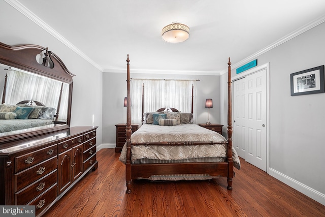 bedroom featuring a closet, baseboards, dark wood-type flooring, and ornamental molding