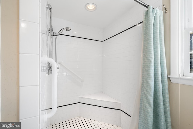 full bath with a shower stall