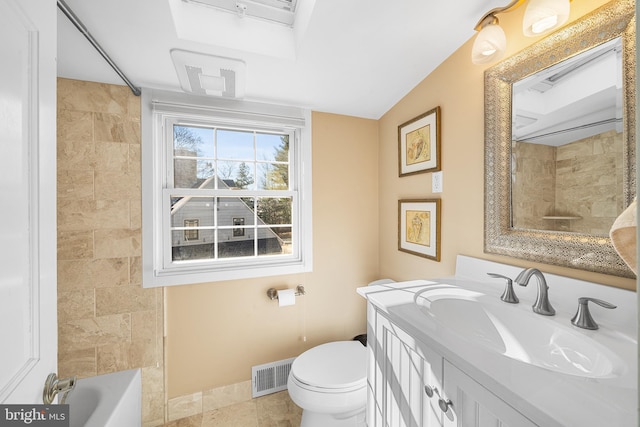 bathroom with tile patterned flooring, visible vents, baseboards, toilet, and vanity