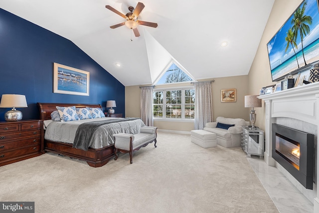 bedroom featuring baseboards, ceiling fan, a fireplace with flush hearth, lofted ceiling, and carpet flooring