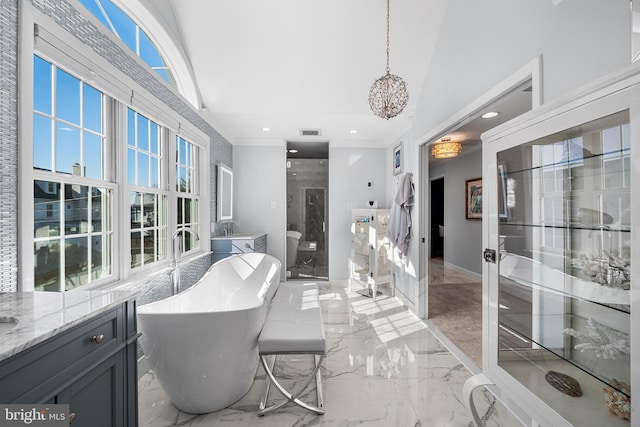 bathroom featuring visible vents, marble finish floor, a stall shower, crown molding, and a freestanding bath