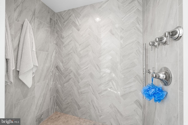 bathroom with tiled shower