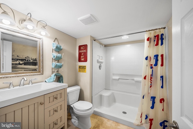 full bath featuring vanity, a shower with curtain, visible vents, tile patterned floors, and toilet