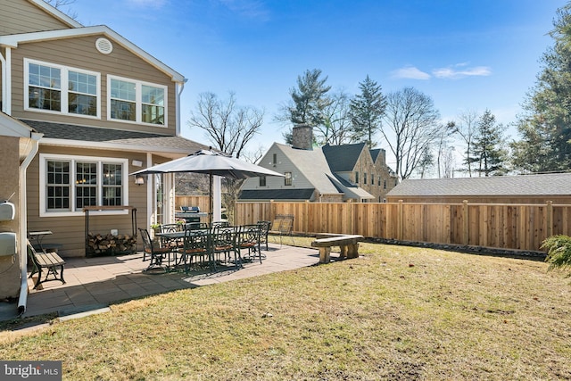 view of yard featuring a patio and fence