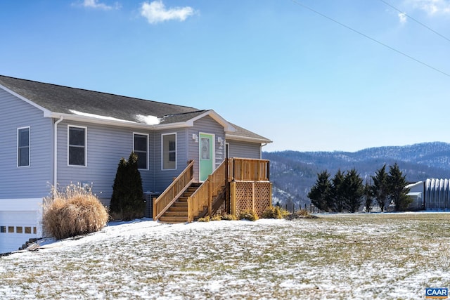 view of front of house featuring stairway and a mountain view