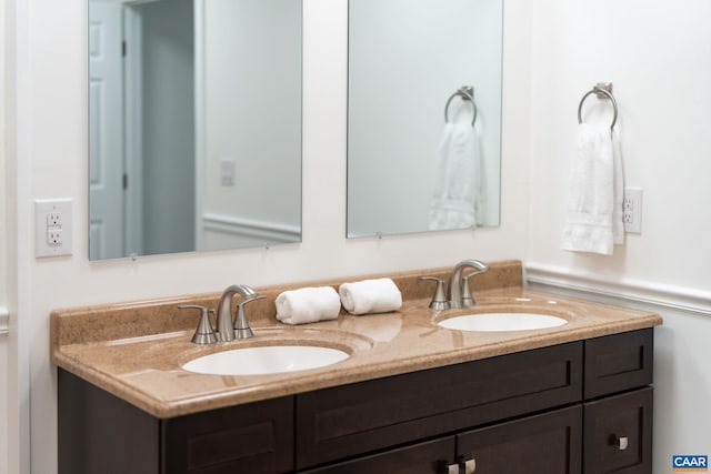 bathroom featuring double vanity and a sink