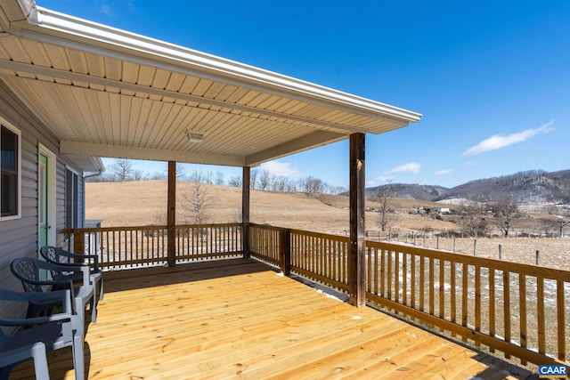 wooden deck featuring a mountain view