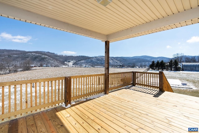 wooden terrace with a mountain view