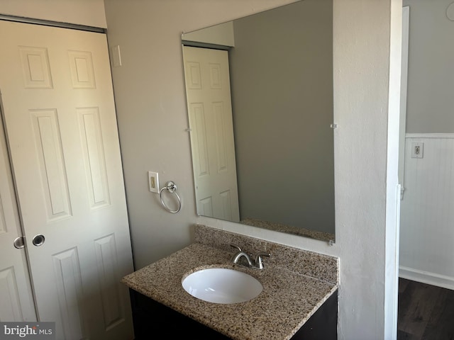 bathroom featuring vanity and wood finished floors