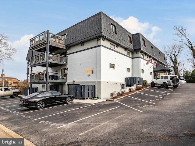 view of property with uncovered parking