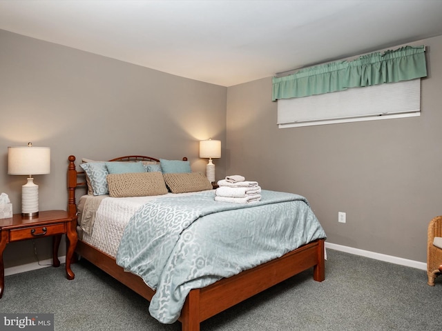 bedroom featuring carpet flooring and baseboards