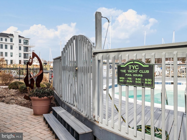 details with fence and a view of the beach