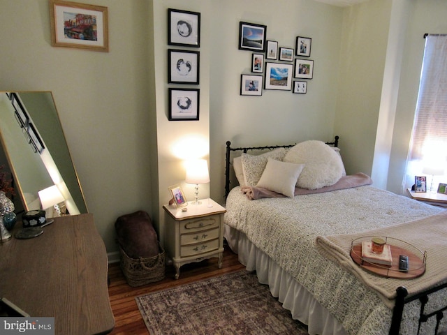 bedroom featuring dark wood-style flooring